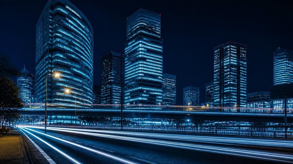 Tokyo region server room: glass-partitioned racks, skyline shot